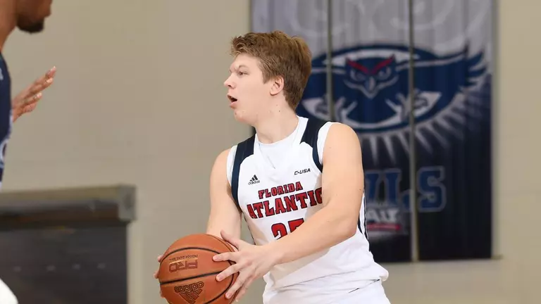 Owls Nipped By USF 60-58