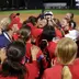 Softball celebrating with Jesiana Mora after hitting the walk-off RBI single against No. 5 Charlotte in the American Conference Quarterfinals