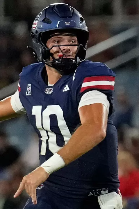 Caden Veltkamp throwing the ball in the 38-30 win against Navy