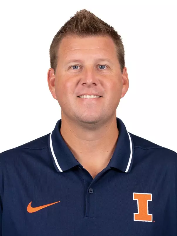 CHAMPAIGN, IL - August 20, 2023 - Illinois Assistant Coach Jacob Eddins headshot taken during 2023 Olympic Sport Headshot Day in the Hall of Fame room of Bielfeldt Athletics Administration Building in Champaign, IL. Photo By Kevin Snyder