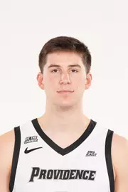 A headshot of men's basketball player Ryan Mela