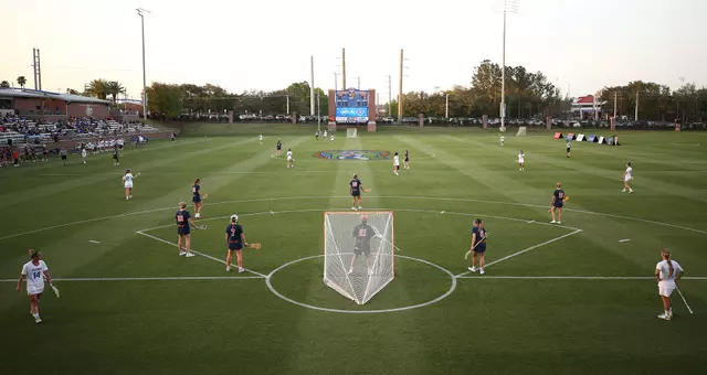Florida vs. Syracuse players wait to start play at Dizney Stadium