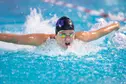 GCU Swimmer competing in butterfly
