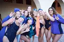 Group of women's swimmer pose together with Lopes up