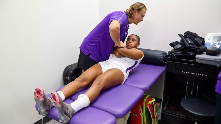 Deaf athletic trainer rises with cochlear, doctorate