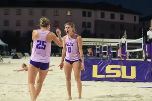 rhea and mae celebrating after win