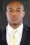 Defensive Coordinator Daryl Dixon headshot with a suit and tie on.