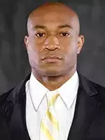 Defensive Coordinator Daryl Dixon headshot with a suit and tie on.