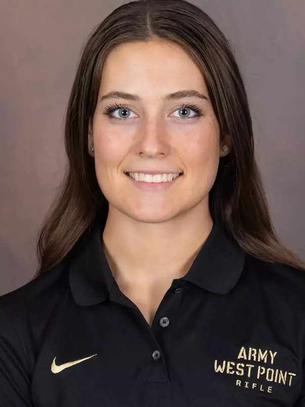 Brenna Green Headshot with a black Army West Point Polo on.