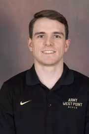 Briggs Moore Headshot with a black Army West Point Polo on.