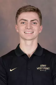 Chris Jennings Headshot with a black Army West Point Polo on.