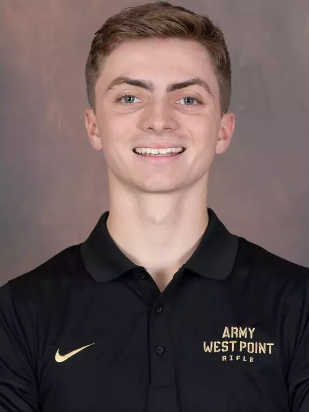 Chris Jennings Headshot with a black Army West Point Polo on.