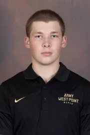 Nicholas Bull Headshot with a black Army West Point Polo on.