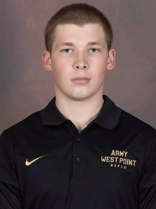 Nicholas Bull Headshot with a black Army West Point Polo on.