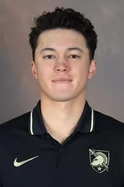 John Heckel Jr. Headshot with a black polo on.