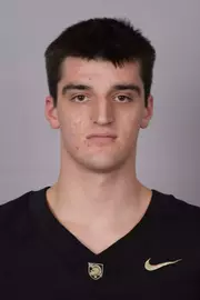 Abram Edwards headshot with a Black Army Football jersey on.