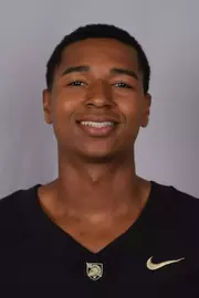 Adam Buffington headshot with a Black Army Football jersey on.