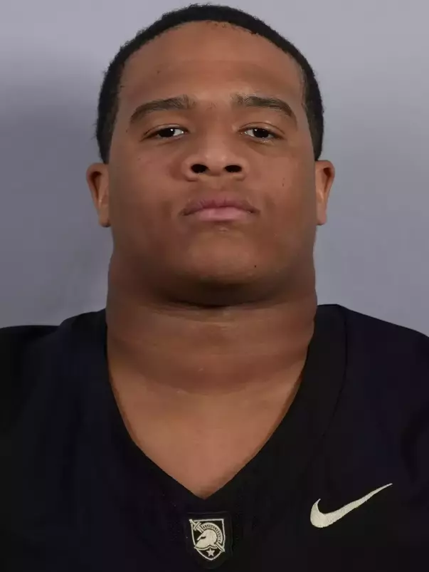 Amir Ali headshot with a Black Army Football jersey on.