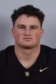 Ben Britton headshot with a Black Army Football jersey on.