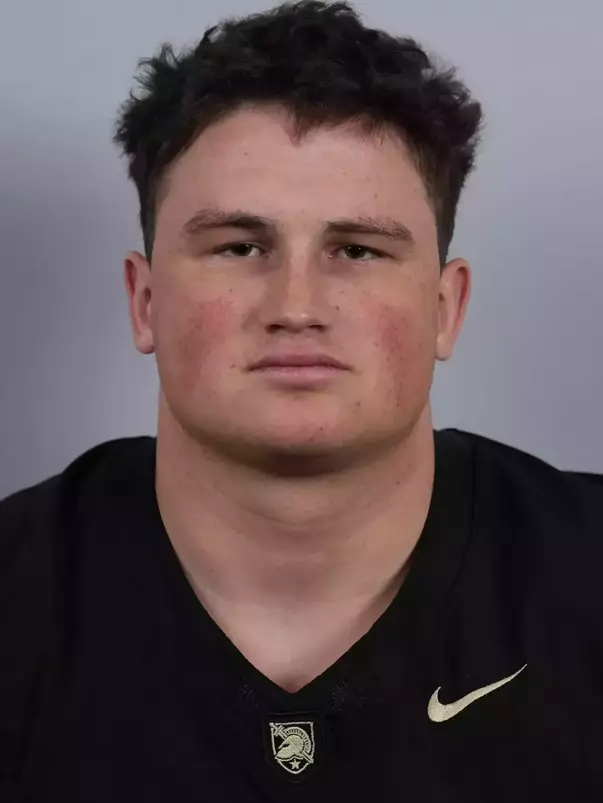 Ben Britton headshot with a Black Army Football jersey on.