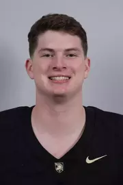 Brian Dyer headshot with a Black Army Football jersey on.