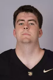 Christopher Broberg headshot with a Black Army Football jersey on.