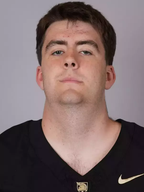 Christopher Broberg headshot with a Black Army Football jersey on.