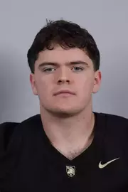 Henry Appleton headshot with a Black Army Football jersey on.