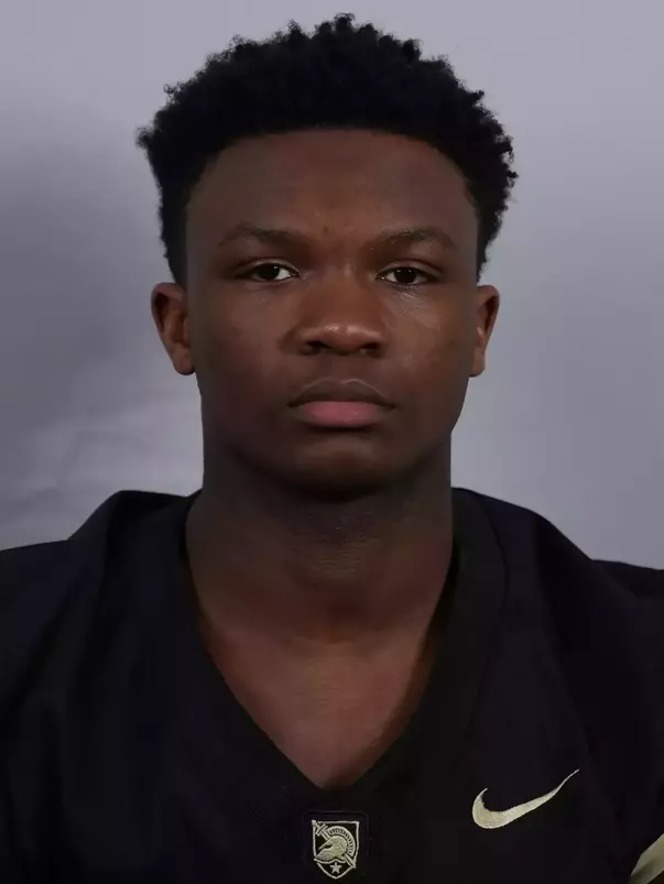 Ish Taylor headshot with a Black Army Football jersey on.