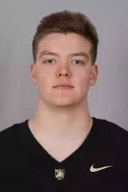 JB Cook headshot with a Black Army Football jersey on.