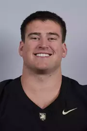 Jake Rendina headshot with a Black Army Football jersey on.