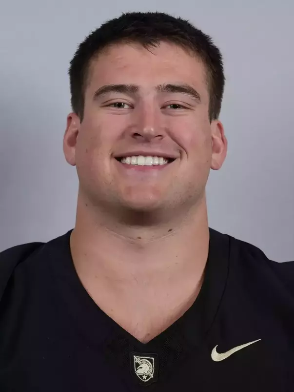 Jake Rendina headshot with a Black Army Football jersey on.