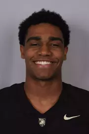 Jakiel Kendricks headshot with a Black Army Football jersey on.