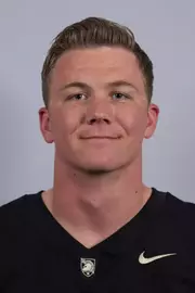 James Wagonseller headshot with a Black Army Football jersey on.