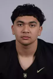 Jonah Zimmerman headshot with a Black Army Football jersey on.