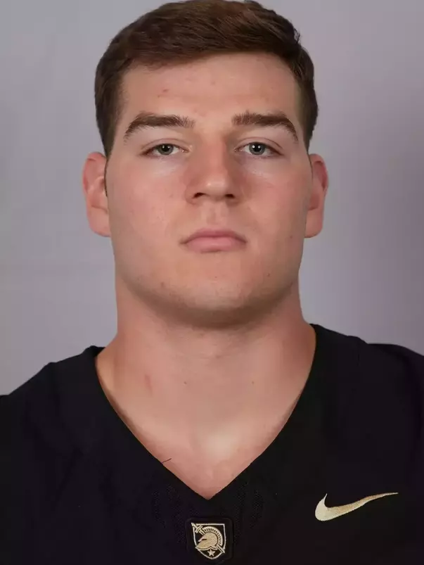 Josh Greer headshot with a Black Army Football jersey on.
