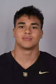 Kai Woolfork headshot with a Black Army Football jersey on.