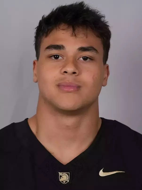 Kai Woolfork headshot with a Black Army Football jersey on.