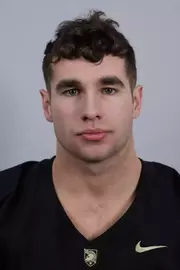 Khaled Waliagha headshot with a Black Army Football jersey on.