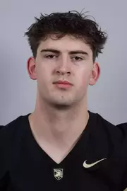 Kurt Thompson headshot with a Black Army Football jersey on.
