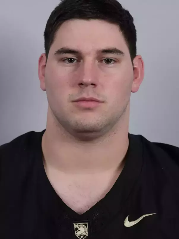 Kyle Kloska headshot with a Black Army Football jersey on.