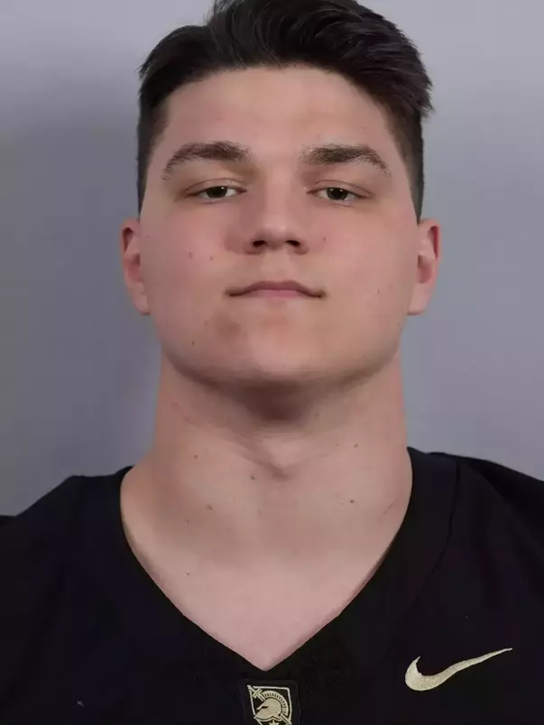 Nick Buchys headshot with a Black Army Football jersey on.