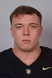 Nick McGlynn headshot with a Black Army Football jersey on.