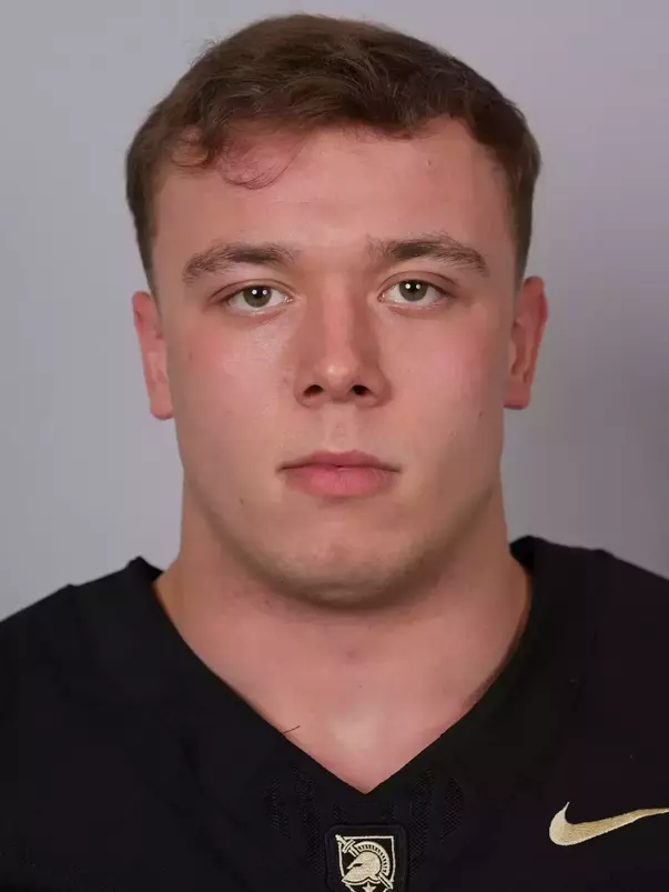 Nick McGlynn headshot with a Black Army Football jersey on.