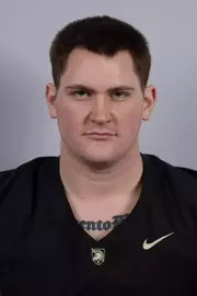 Paolo Gennarelli headshot with a Black Army Football jersey on.