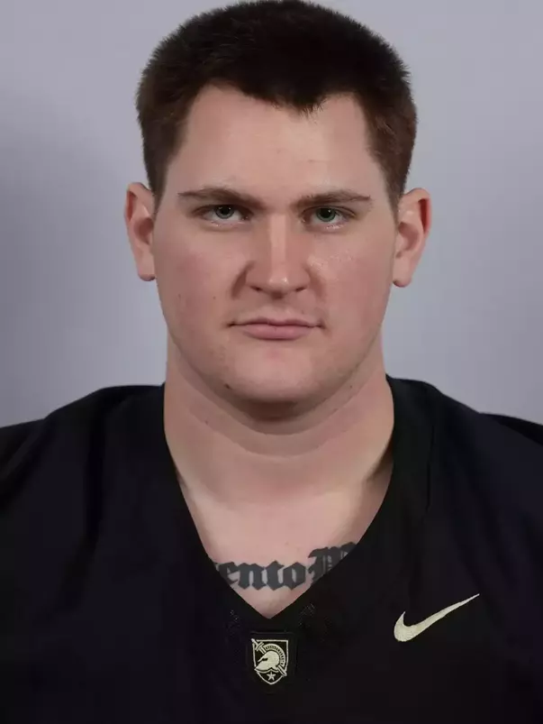 Paolo Gennarelli headshot with a Black Army Football jersey on.
