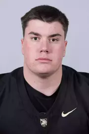 Sam Waters headshot with a Black Army Football jersey on.