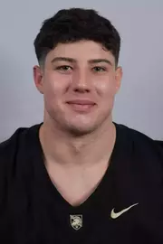 Sam Zagame headshot with a Black Army Football jersey on.