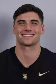 Sean Donovan headshot with a Black Army Football jersey on.