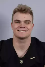 Teddy Williams headshot with a Black Army Football jersey on.